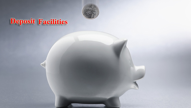 Coin Dropping Into Piggy Bank --- Image by © Royalty-Free/Corbis